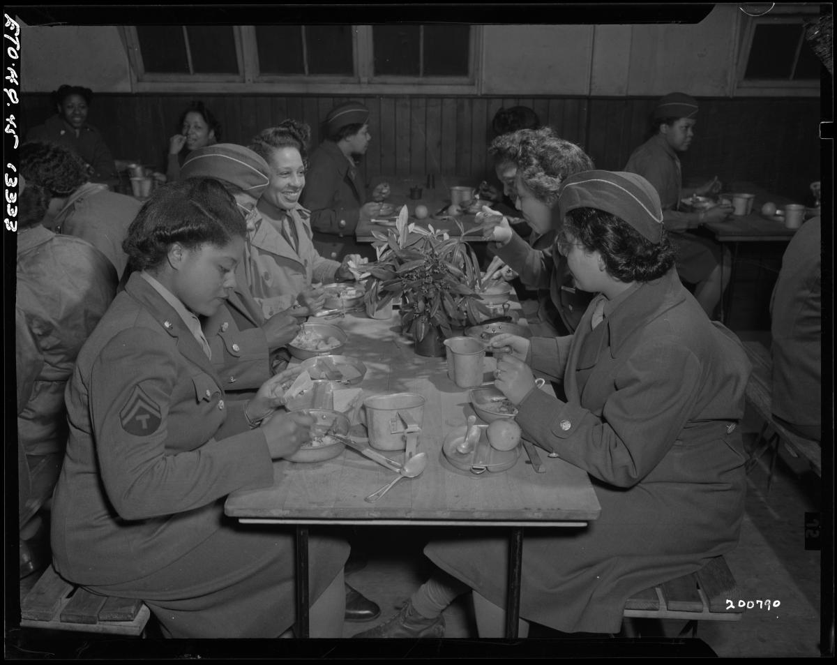 Members of the 6888th Central Postal Directory Battalion eating together in England in 1945